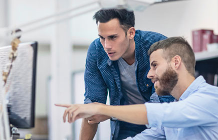 Larkin Hathaway project team coordinating on a HVAC project in front of a computer screen